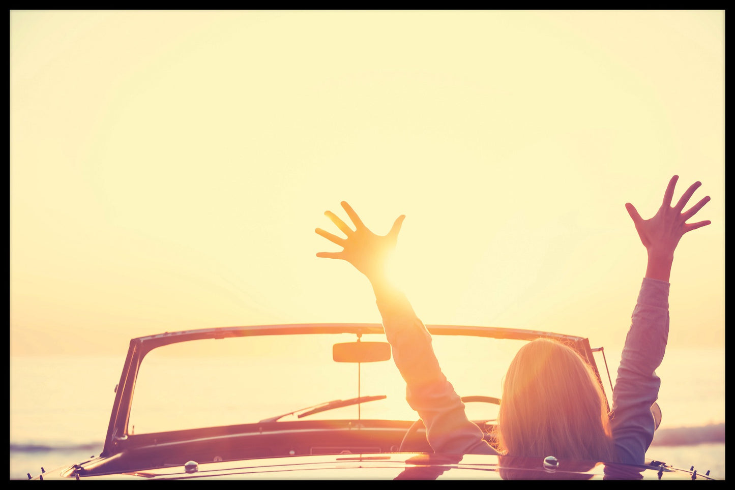 Cabriolet i solnedgangsstolper